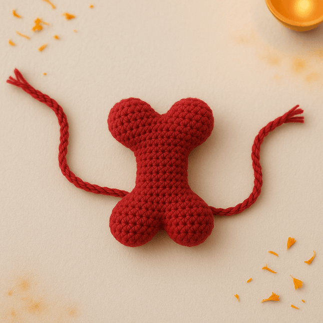 Rakhi Combo for Dogs – red crochet bone-shaped rakhi with braided thread, part of PawTaaka Bandana + Rakhi Gift ₹499 festive set.