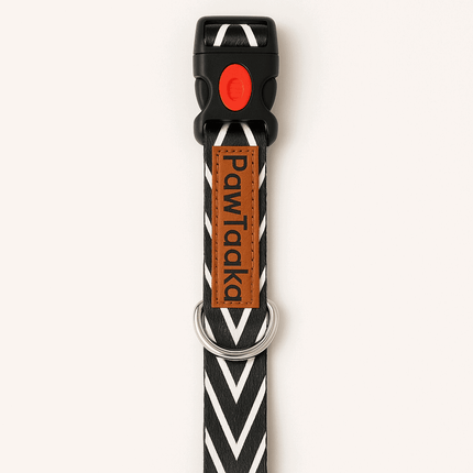 Chevron print black dog collar by PawTaaka with secure red buckle and metal D-ring, ideal for stylish and safe pet walks.