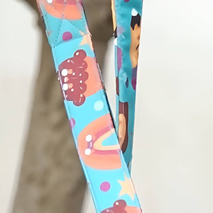 Close-up of PawTaaka Fun Dog Leash – Mood Booster Donut & Rainbow with glossy finish and playful donut and bear pattern.