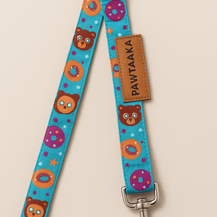 Fun Dog Leash – Mood Booster Donut & Rainbow by PawTaaka featuring colorful bear and donut prints on a blue background with metal clasp.