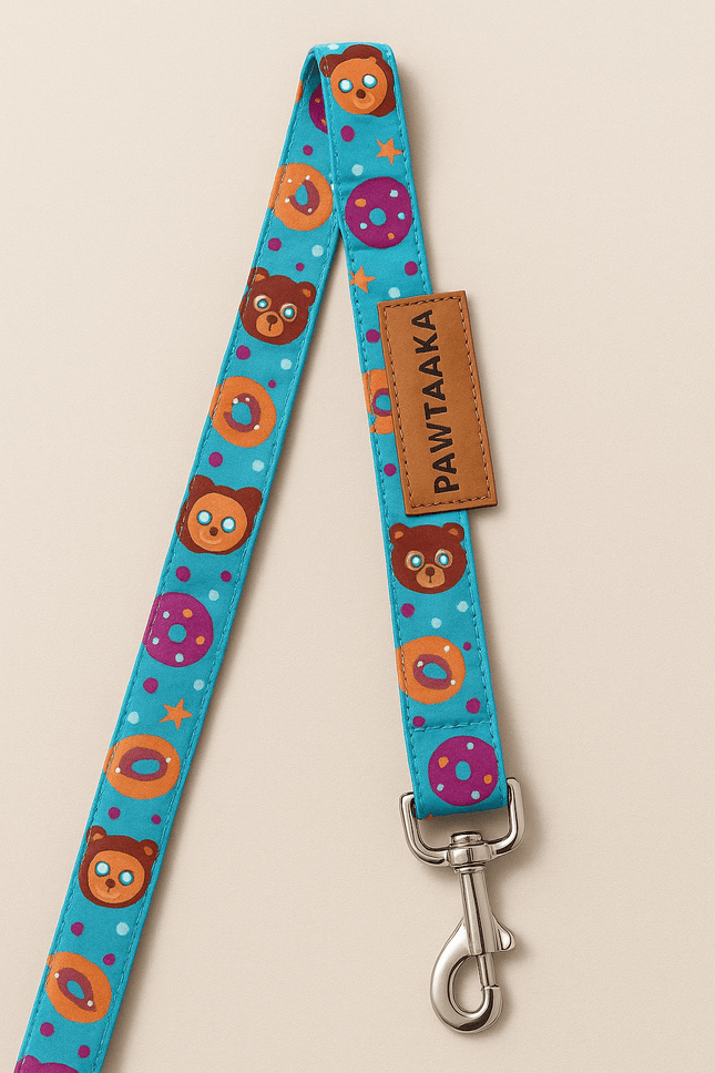 Fun Dog Leash – Mood Booster Donut & Rainbow by PawTaaka featuring colorful bear and donut prints on a blue background with metal clasp.